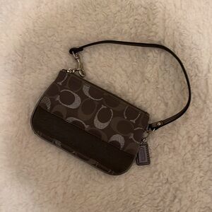 Coach gray wristlet . Great condition a phew stains inside not very visible